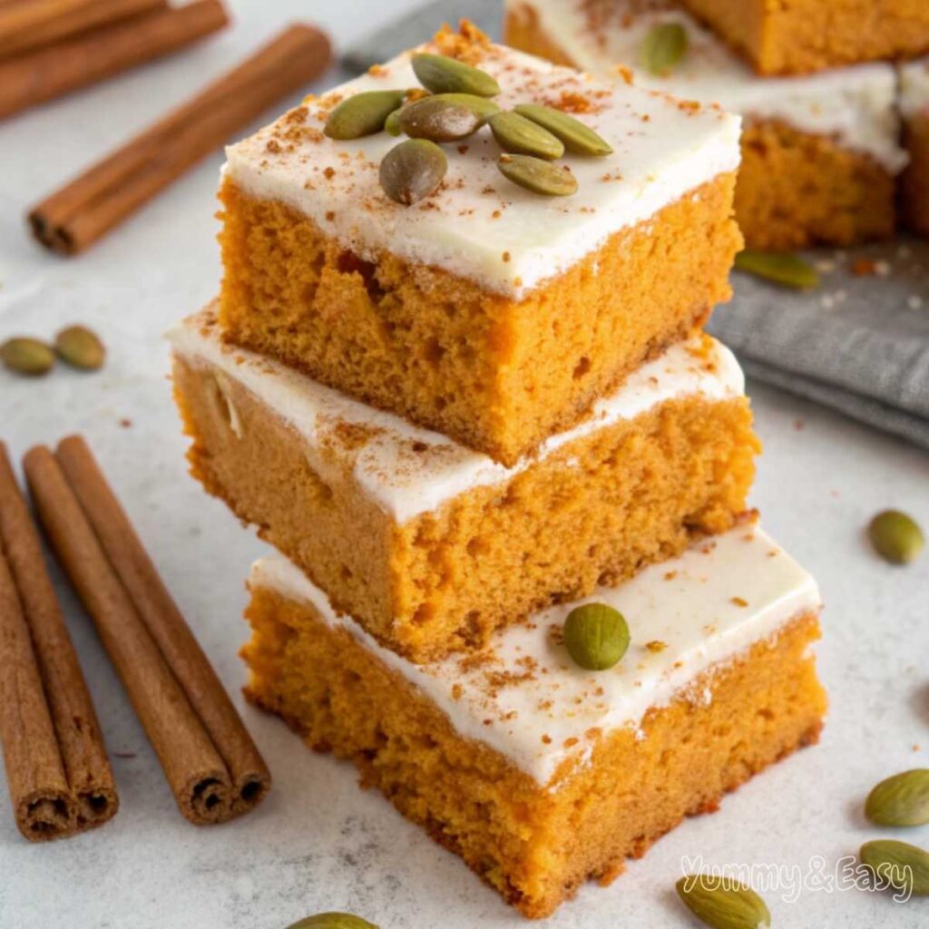 A plate of pumpkin bars with a moist texture